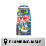 Drāno Dual-Force Foamer bottle on a white background with a 'Plumbing Aisle' metal sign beneath it.