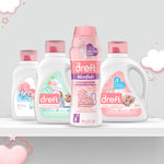 Product lineup with Dreft Blissfuls scent booster bottle centered among multiple Dreft detergent bottles on a shelf