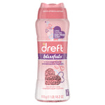 Studio product shot of a Dreft Blissfuls pink bottle showing label, heart-shaped window of pink beads and dosage text at the bottom.