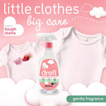 Dreft Laundry Stain Remover bottle in front of baby onesies on a pink background with gentle fragrance callout