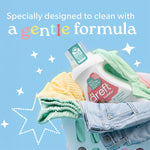Dreft detergent bottle in a laundry basket with folded clothes and a pastel blue background stating a gentle formula.