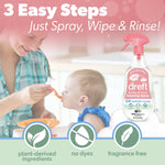 Woman feeding a baby in a kitchen scene with a Dreft foaming spray bottle and icons stating plant-derived ingredients, no dyes, fragrance free.