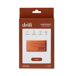 Front-facing retail box for Drift car scent wood refill in amber, showing a wood freshener image and amber label.