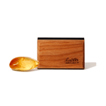 Drift wooden car air freshener block with engraved logo shown next to an amber resin piece