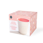 Packaged Dritz ceramic thimble container shown on decorative pink box with product photo and branding