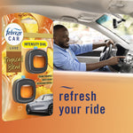 Lifestyle image showing driver in a car with Febreze Car Tropical Blend package graphic and 'refresh your ride' text