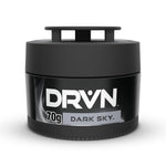 Close-up studio photo of a black DRVN gel can air freshener labeled 'Dark Sky' with 70g on the front.