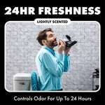 Man in a bathroom smelling a pack of DUDE Wipes beneath text claiming 24hr freshness and odor control for up to 24 hours.