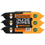 Three-pack DUDE WIPES DUMPkin spice flushable wipes stacked, orange and black packaging showing plant-sourced fibers badge and barcode.