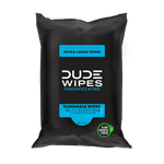 Front-facing black Dude Wipes resealable pack showing Extra Large Flushable Wipes blue label and plant-sourced fibers icon