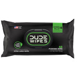 Studio product shot of a single black DUDE Wipes herbal relief pack with central plastic pop-up lid and visible branding.