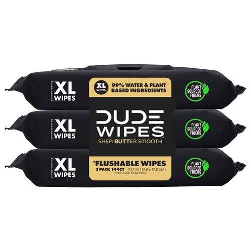 Three stacked black DUDE Wipes packets with XL label, plant sourced fibers badge and central brand panel