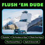 Toilet in a snowy outdoor scene with multiple DUDE Wipes packs arranged on and around it and bold green headline text.