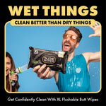 Energetic lifestyle shot of a person holding a DUDE Wipes pack with water splashing, headline ‘Wet Things’