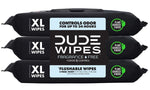 Three black packets of DUDE WIPES XL flushable wipes stacked horizontally showing central logo and XL wipes badge