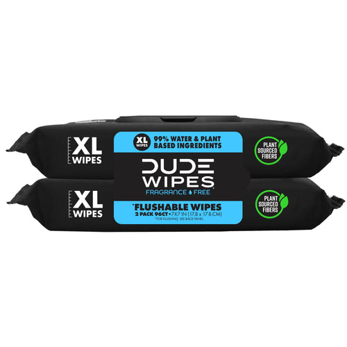 Front-facing stacked DUDE Wipes XL packs in black packaging showing brand logo and plant-sourced fibers badge.