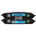 Stacked DUDE Wipes XL packs front view showing barcode and plant-sourced fibers badge on black packaging.