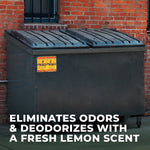 Outdoor dumpster against a brick wall with overlay text claiming elimination of odors and a fresh lemon scent