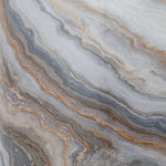 Close-up texture detail of agate-style marbled pattern in gray, white and warm brown veining on the product surface.