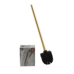 Disassembled view of agate-patterned square holder and gold-handle toilet brush with black bristles on white background.