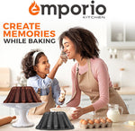 Lifestyle scene of a smiling adult and child baking together with a finished bundt cake on a stand and a speckled pan in the foreground