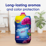 Ensueño Max Spring Fresh fabric softener jug in a laundry room scene with headline text about long-lasting aromas and color protection.