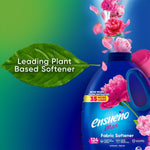 Partial bottle of ensueño fabric softener with pink flowers and a large green leaf reading Leading Plant Based Softener