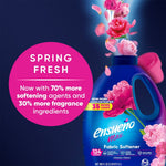 Ensueño max bottle with pink floral burst and circular pink badge reading spring fresh and ingredient/softening claims