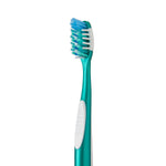 Close-up of a single Equate toothbrush head and teal handle showing multi-level blue and white bristles and rubber grip