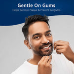 Man flossing his teeth with text above reading 'Gentle On Gums' and a subheading about removing plaque and preventing gingivitis.
