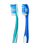 Close-up of two Equate toothbrush heads and upper handles, showing multi-level blue and white bristles and textured grips.