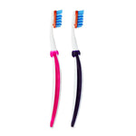 Two Equate manual toothbrushes side by side, one with pink trim and one with purple trim.
