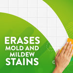 Graphic showing a hand wiping tiled surface with text overlay that reads "Erases mold and mildew stains"