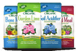Several Espoma organic product bags displayed side-by-side including Garden Lime and Soil Acidifier with colorful package fronts