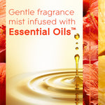 Graphic panel stating ‘Gentle fragrance mist infused with Essential Oils’ with a droplet splash and floral side panels.