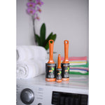 Three Evercare Gain-scented lint rollers staged on a laundry machine with towels and folded clothes