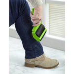 Person using green Evercare gel lint roller on jeans to remove pet hair near a window