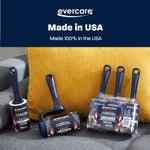 Lifestyle image of multiple Evercare navy T-handle lint rollers and refill packs arranged on a grey couch with a mustard pillow