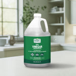 Photo of a one-gallon Expert Gardener 30% vinegar concentrate plastic jug with green label set on a kitchen counter
