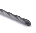 Close-up of the pointed tip of a black twisted nylon anchor spike on a white background.