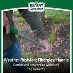 Person holding an Expert Gardener rake showing the weather-resistant fiberglass handle in a garden setting