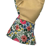Close-up of floral fabric cuff and tan leather palm of a gardening glove