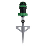 Green and black spike-mounted pulsating lawn sprinkler shown head-on on white background