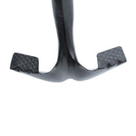 Detailed close-up of shovel grooved stepper with textured foot pads, shown on white background