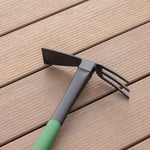 Expert Gardener hand hoe/cultivator laid on a wood surface showing the dual-purpose head and green handle