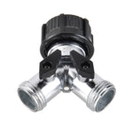 Top-down view of a metal two-way hose splitter showing two black shut-off levers and the black plastic adapter at the inlet.