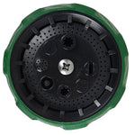 Close-up of the nozzle face with green outer ring and circular pattern of small spray holes