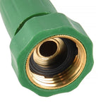 Close-up of the threaded hose connector on a brass twist nozzle with green plastic exterior
