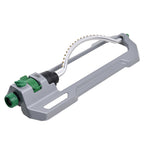 Perspective view of a gray oscillating sprinkler showing curved metal spray bar and green controls.