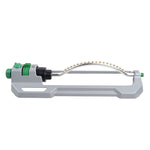 Side profile of a gray oscillating lawn sprinkler showing spray bar, base and green connector on white background.